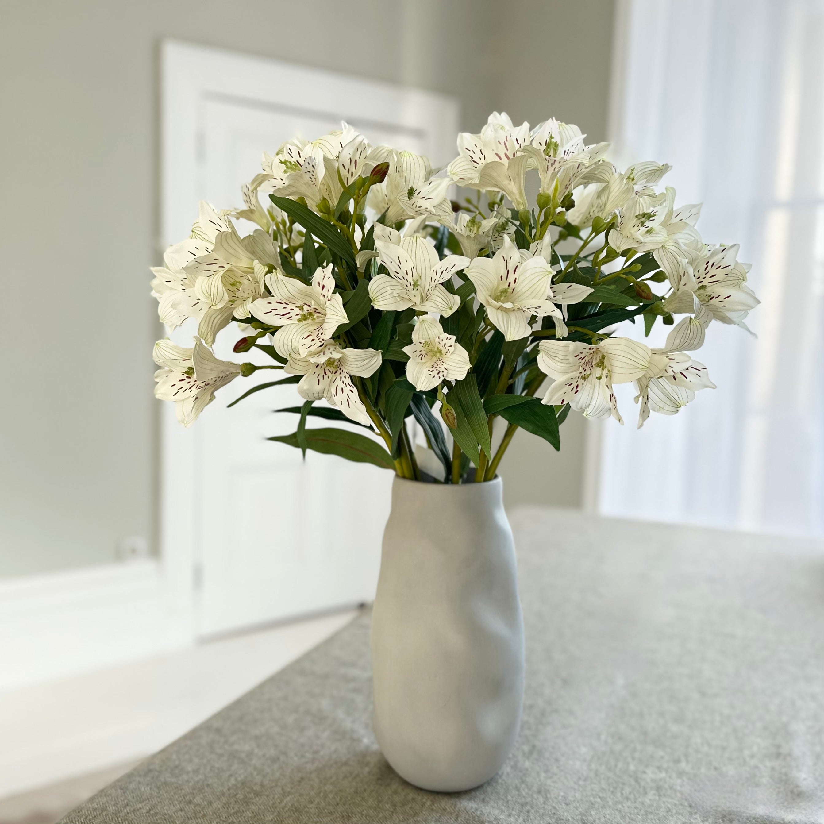 Luxury Lifelike Realistic Artificial Fabric Faux Silk Luxury White Small Lily ABX8543WH Artificial Flower Arrangement with Faux Foliage Buy Online from The Faux Flower Company Trade Wholesale
